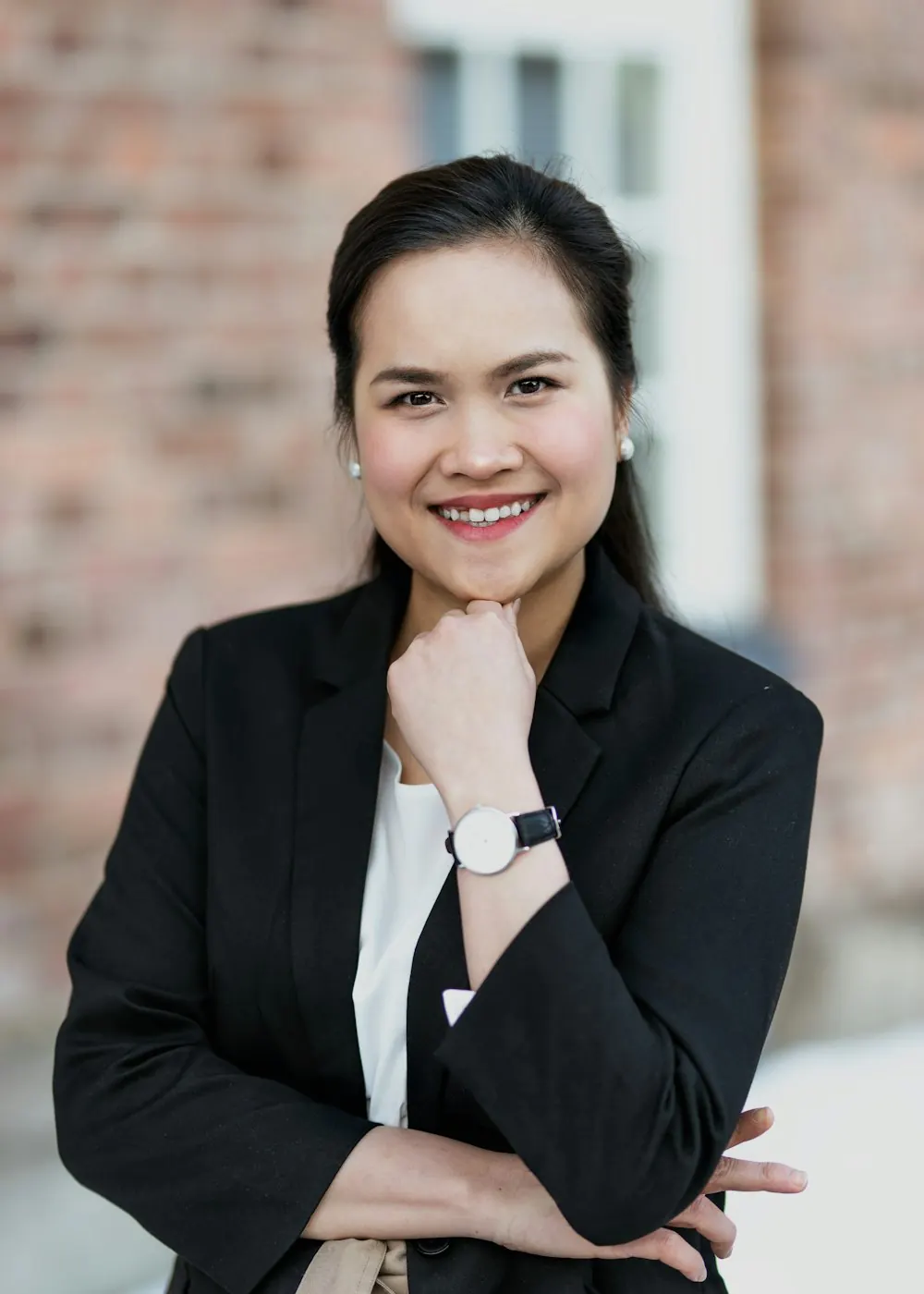 Smiling businesswoman in a black blazer